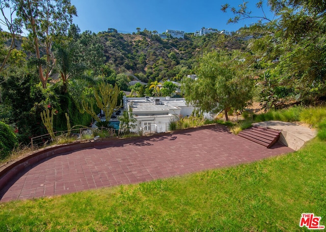 view of patio / terrace with a mountain view