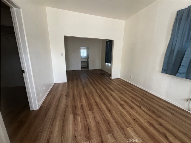 empty room with dark hardwood / wood-style floors