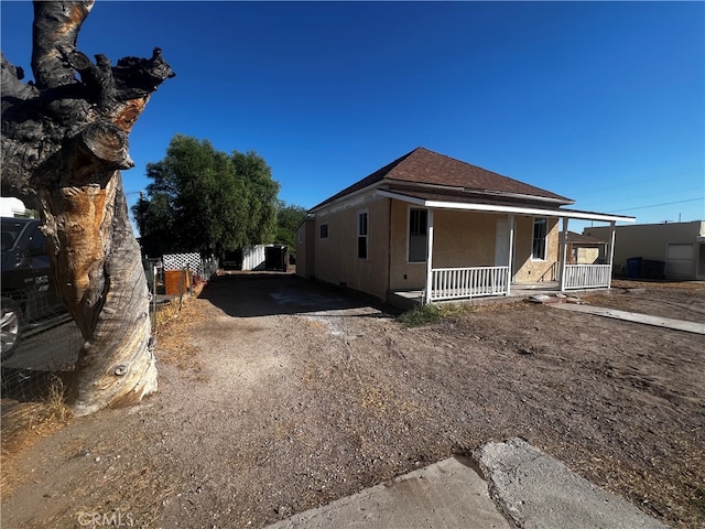 view of home's exterior with covered porch