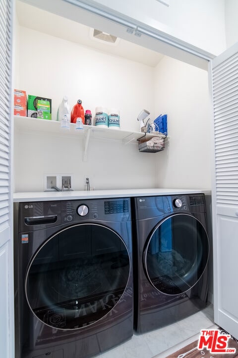 laundry room featuring washer and dryer