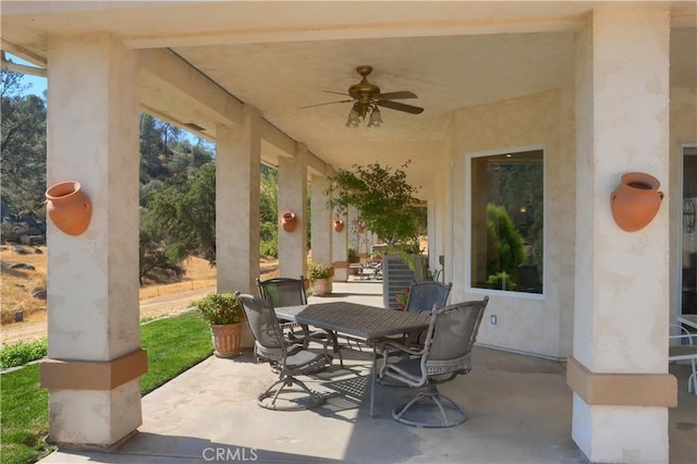 view of patio / terrace with a ceiling fan and outdoor dining area