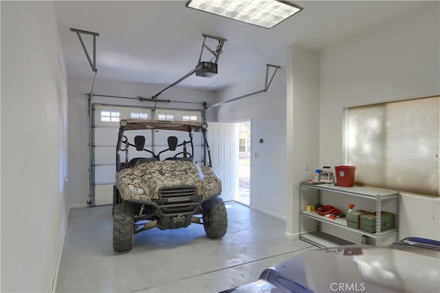 garage featuring baseboards and a garage door opener