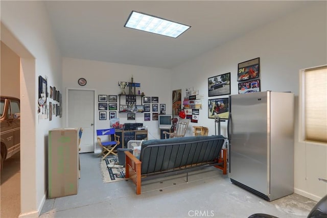 living area with concrete floors