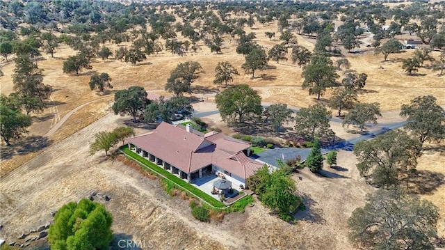 birds eye view of property with a rural view and view of desert