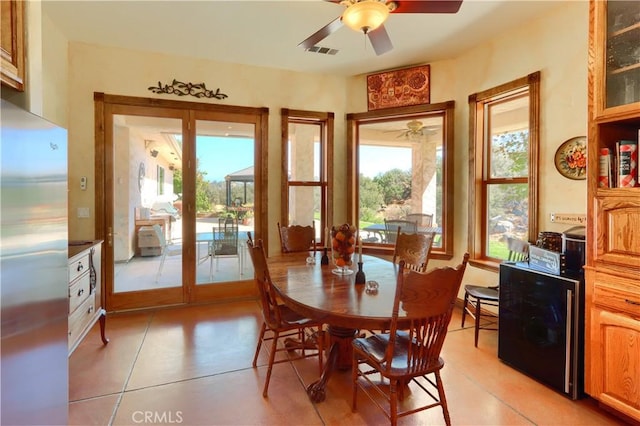 dining room featuring a wealth of natural light, visible vents, and ceiling fan