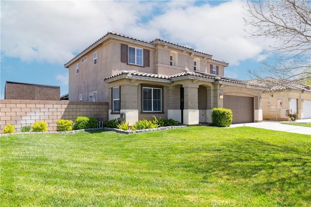 mediterranean / spanish-style home with a front yard