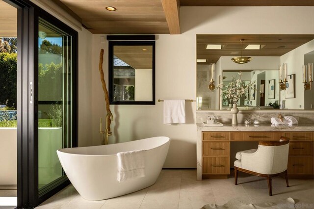 bathroom featuring vanity, a bathtub, tile patterned flooring, and wooden ceiling