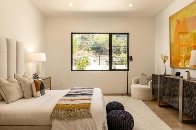 bedroom with light hardwood / wood-style floors