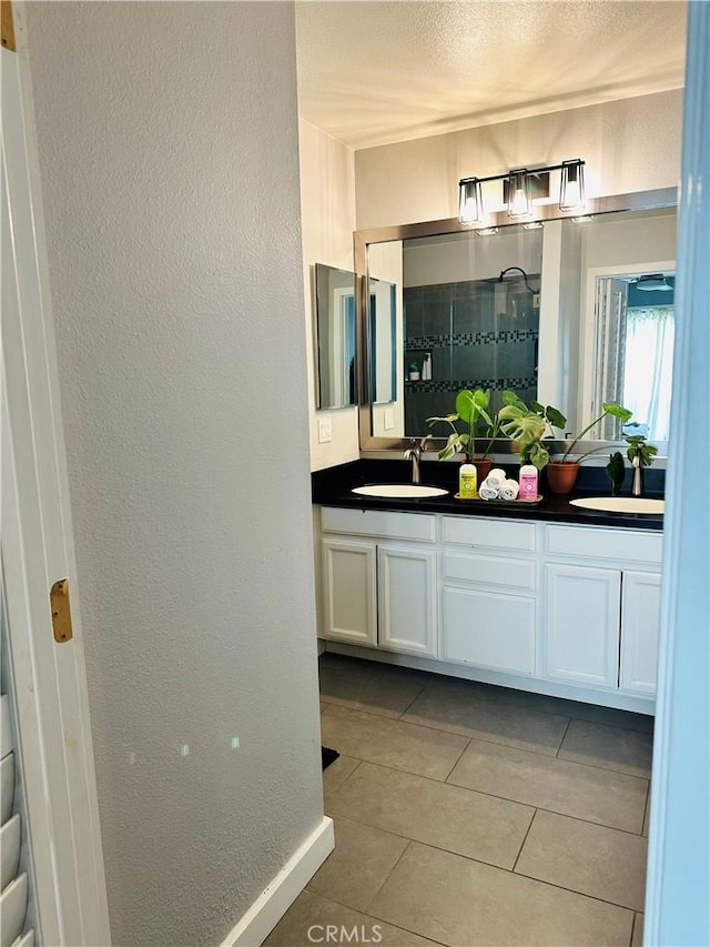 bathroom with vanity and tile patterned floors