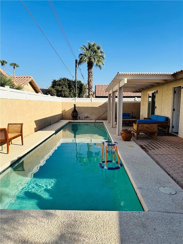 view of swimming pool featuring a patio area