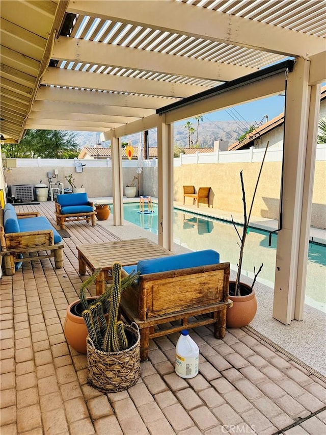 view of patio featuring an outdoor hangout area, cooling unit, a pergola, and a fenced in pool