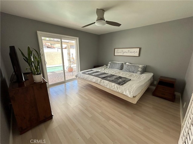 bedroom with light wood-type flooring, ceiling fan, and access to exterior