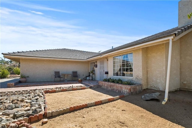 rear view of house featuring a patio area