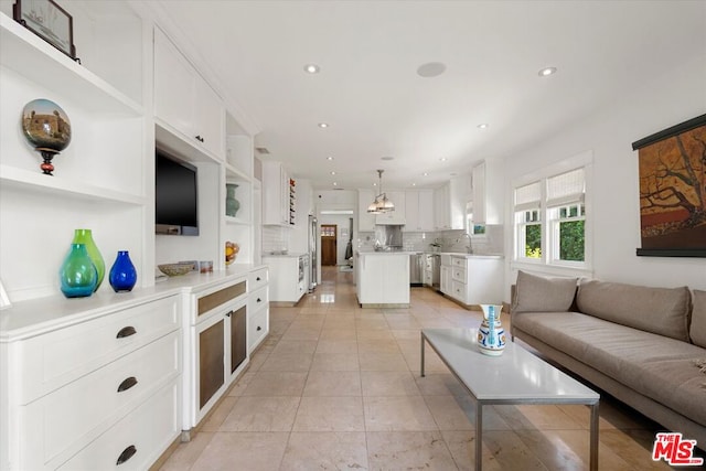 tiled living room featuring sink