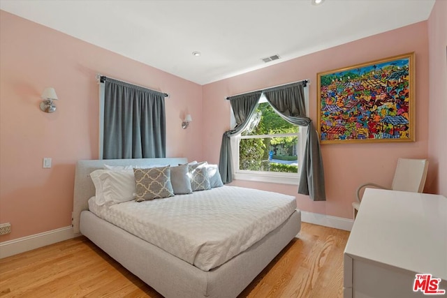 bedroom featuring wood-type flooring