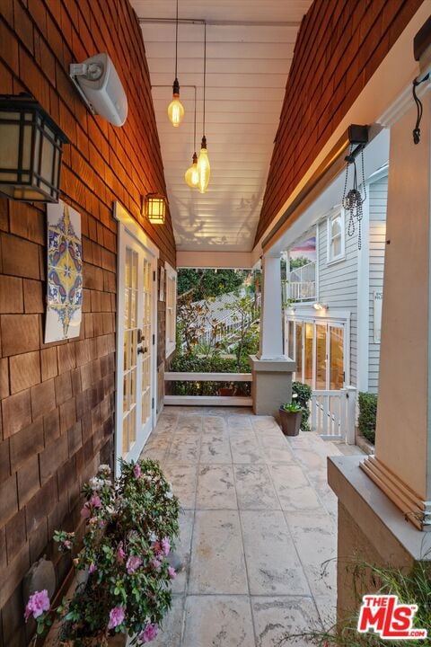 view of patio featuring a porch