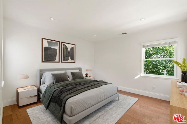 bedroom featuring light hardwood / wood-style floors