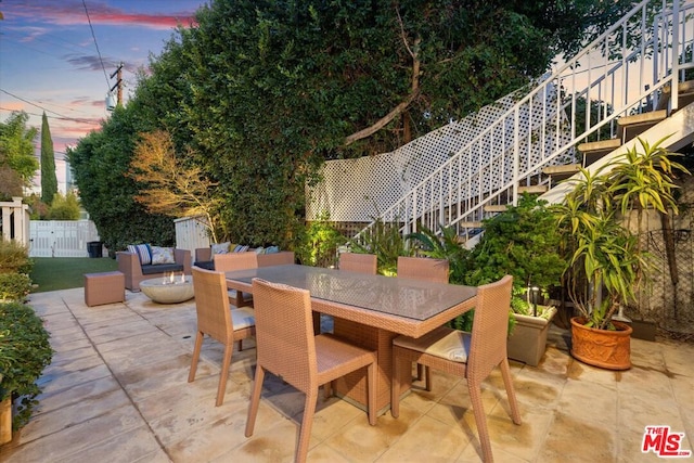 view of patio terrace at dusk