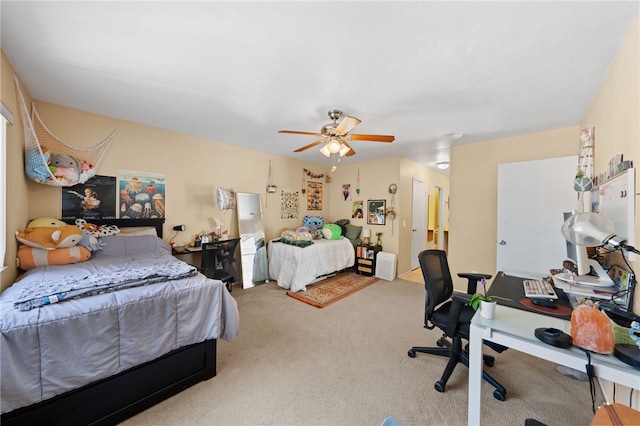 bedroom featuring ceiling fan and carpet