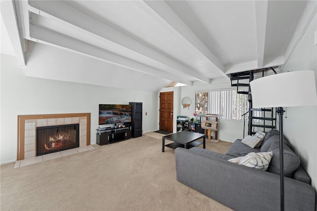 carpeted living room featuring a fireplace and beamed ceiling