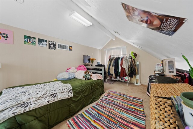 carpeted bedroom with lofted ceiling with beams