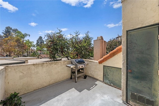 balcony with grilling area and a patio area