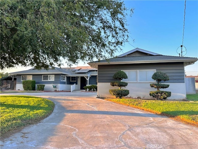 ranch-style house with solar panels