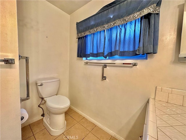 bathroom featuring tile patterned floors and toilet