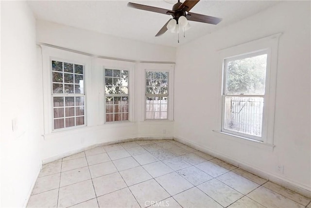 tiled empty room with ceiling fan