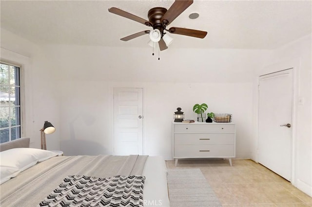 bedroom featuring ceiling fan and light tile patterned floors