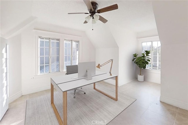 office space featuring ceiling fan and lofted ceiling