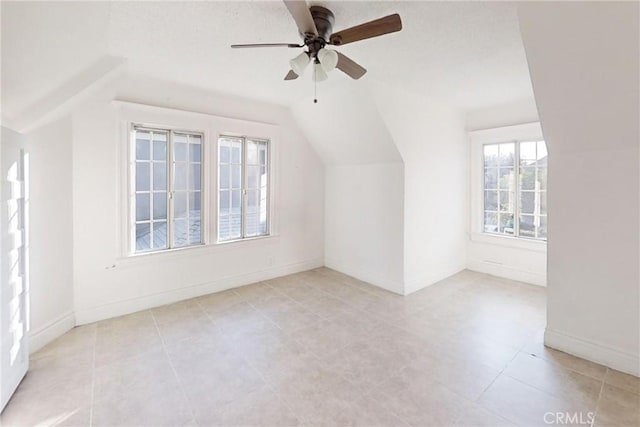 bonus room with ceiling fan and vaulted ceiling