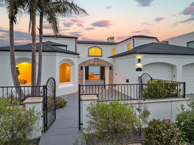 mediterranean / spanish-style home featuring a garage