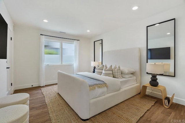 bedroom with wood-type flooring