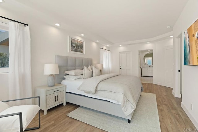 bedroom featuring light wood-type flooring