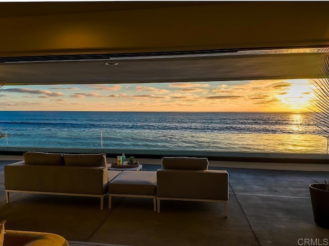 common area with a water view and a beach view