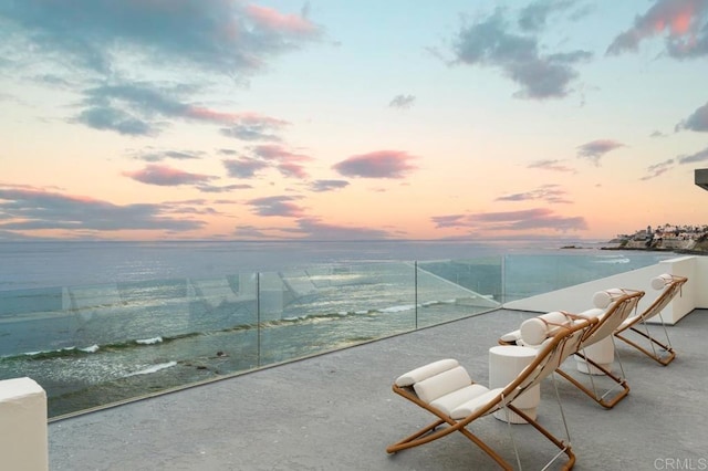 balcony at dusk with a water view