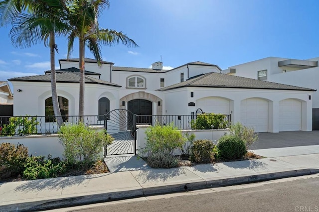 mediterranean / spanish house with a garage