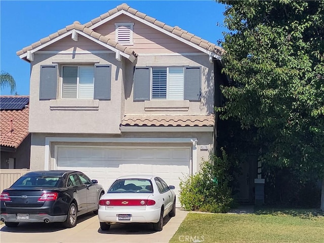 view of front of property with a garage