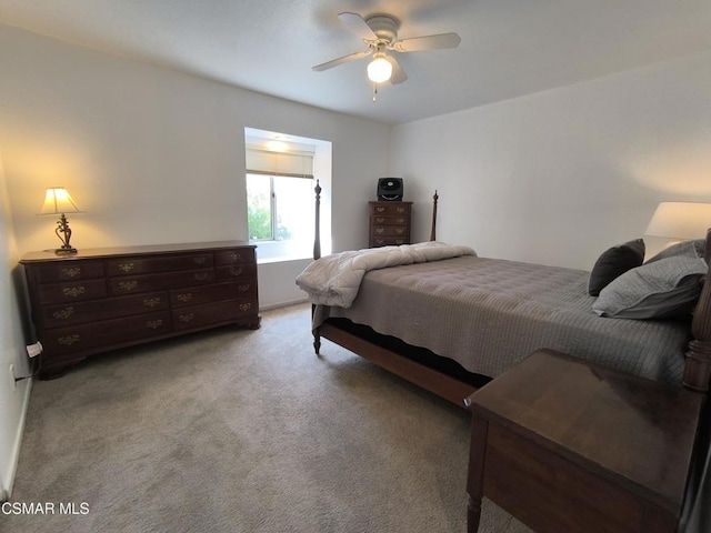 bedroom with ceiling fan and light colored carpet