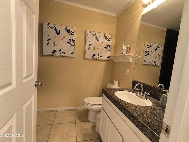 bathroom featuring tile patterned floors, vanity, toilet, and crown molding