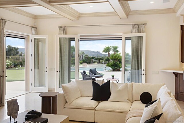 living room featuring ornamental molding, a mountain view, coffered ceiling, and beam ceiling