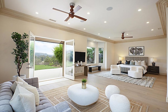 bedroom with access to exterior, crown molding, and light hardwood / wood-style floors