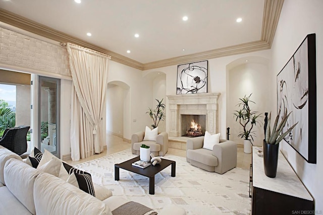 living room with crown molding and a fireplace