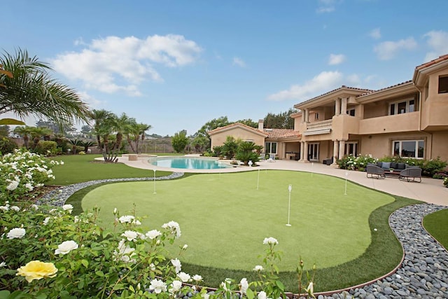 view of community featuring a pool and a patio