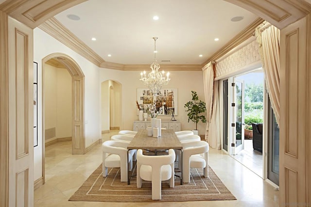 dining room with an inviting chandelier and crown molding