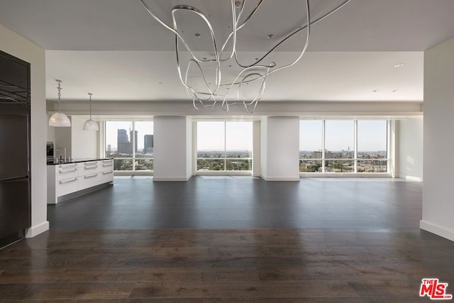 unfurnished living room featuring dark wood-type flooring