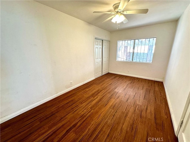 unfurnished room featuring ceiling fan and hardwood / wood-style floors