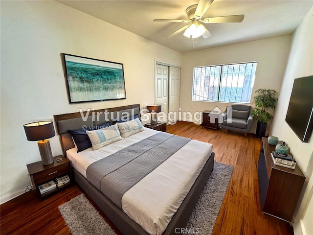 bedroom with ceiling fan, dark hardwood / wood-style flooring, and a closet