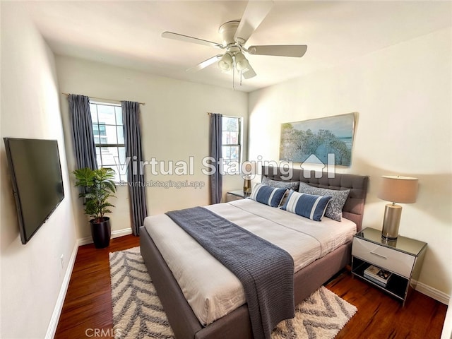 bedroom featuring dark hardwood / wood-style floors and ceiling fan